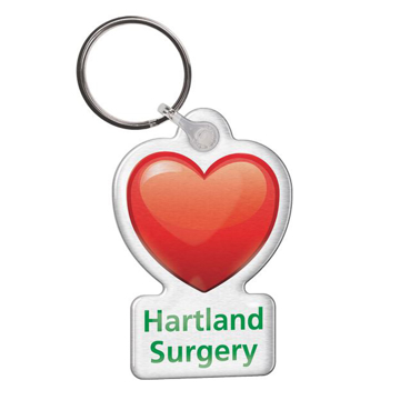 a heart shaped full colour keyring with a surgery logo