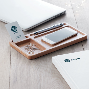 a bamboo desktop organiser filled with stationery and wireless charger