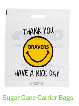 A sugar cane plastic carrier bag with a smiley face on it