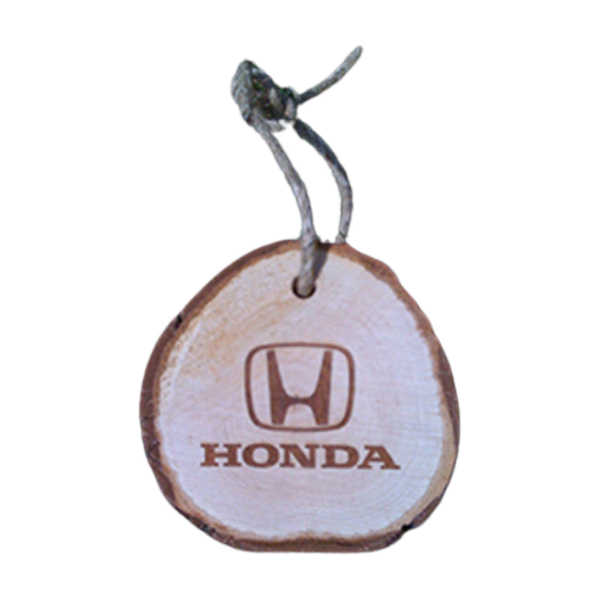 	A wooden bauble that has been engraved with the word Honda