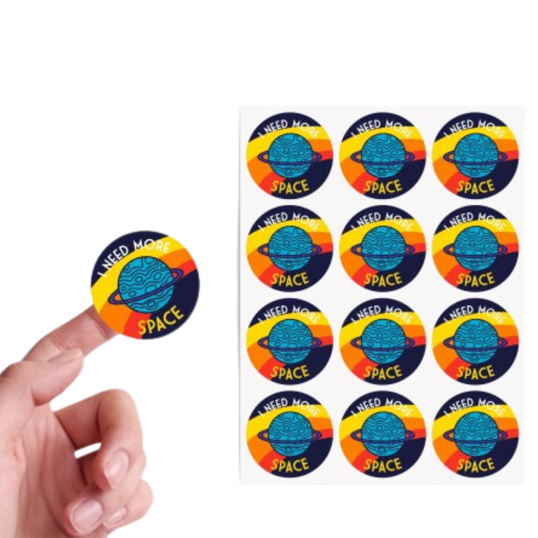 round paper stickers on a sheet with hand holding one sticker
