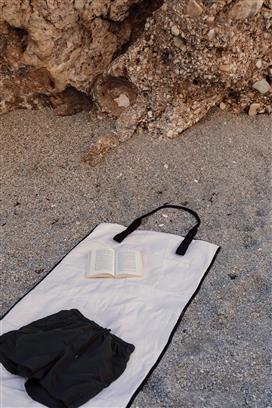 Off white beach mat on beach