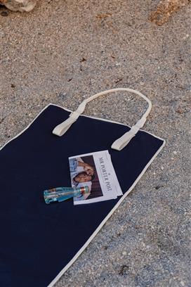 Blue beach mat on beach