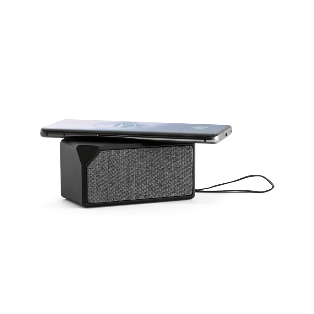 portable speaker with wireless charging in use